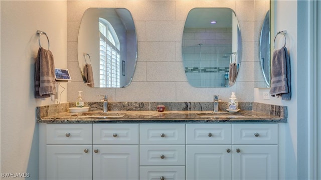 bathroom with double vanity and a sink