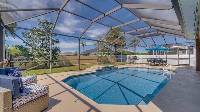 view of pool with a fenced in pool, a patio, a lanai, a fenced backyard, and a jacuzzi