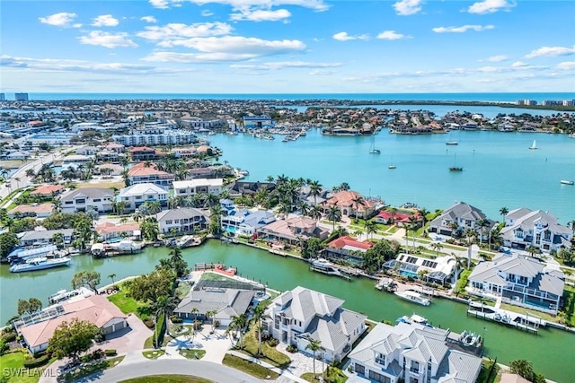 drone / aerial view featuring a water view and a residential view