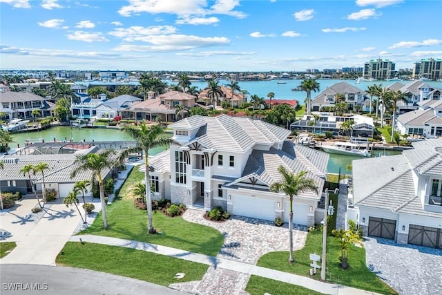 aerial view featuring a water view and a residential view