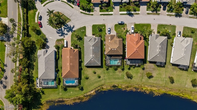 bird's eye view with a water view and a residential view