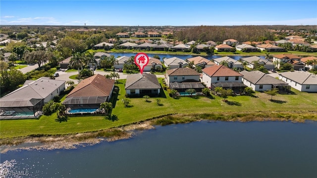 birds eye view of property with a residential view and a water view