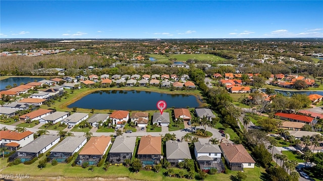 birds eye view of property featuring a residential view and a water view