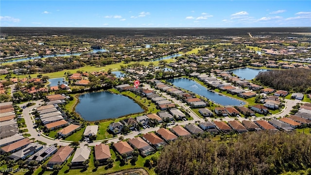 drone / aerial view with a residential view and a water view