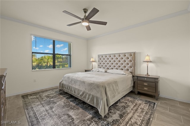 bedroom with ornamental molding, baseboards, and a ceiling fan