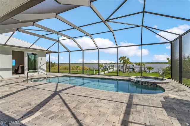 view of pool with glass enclosure, a patio area, and a pool with connected hot tub