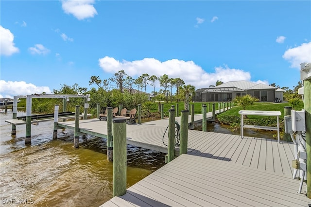 dock area with a water view and boat lift