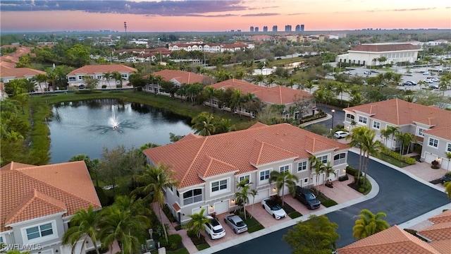 bird's eye view with a water view and a residential view