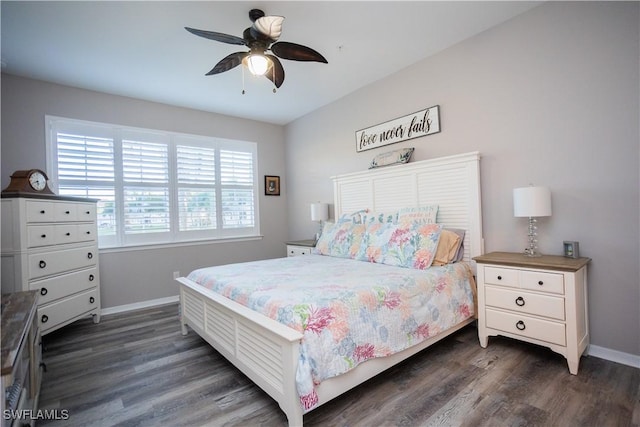 bedroom with a ceiling fan, baseboards, and dark wood-type flooring