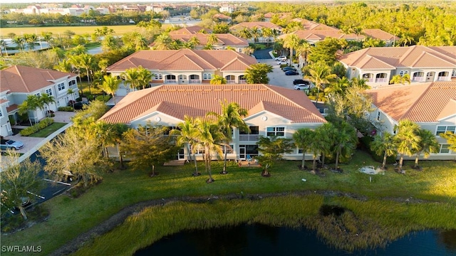 bird's eye view with a residential view and a water view