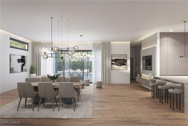 dining area featuring a chandelier and light wood-style floors