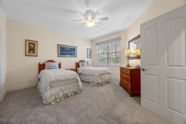 bedroom with baseboards, light carpet, and a ceiling fan