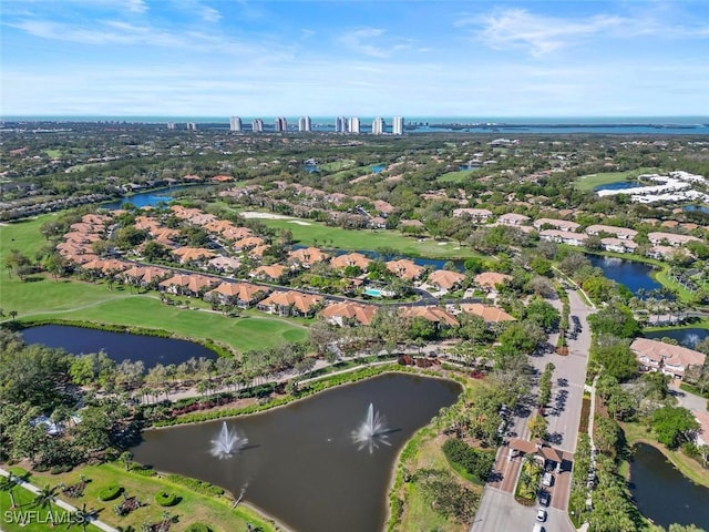 aerial view with view of golf course and a water view