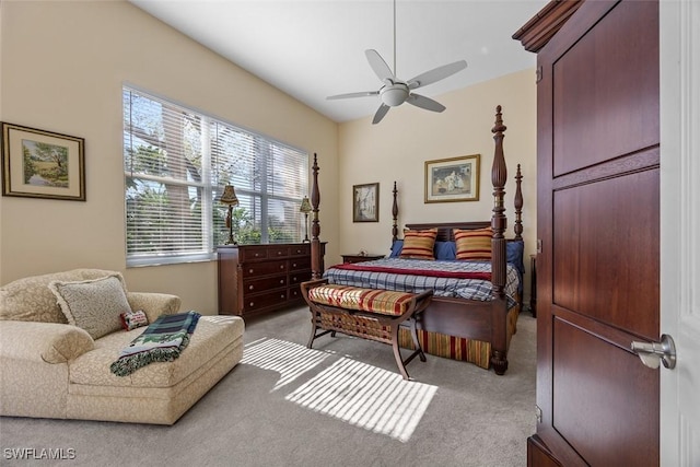 bedroom featuring light carpet and ceiling fan