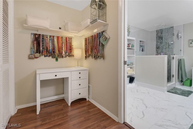 spacious closet with wood finished floors