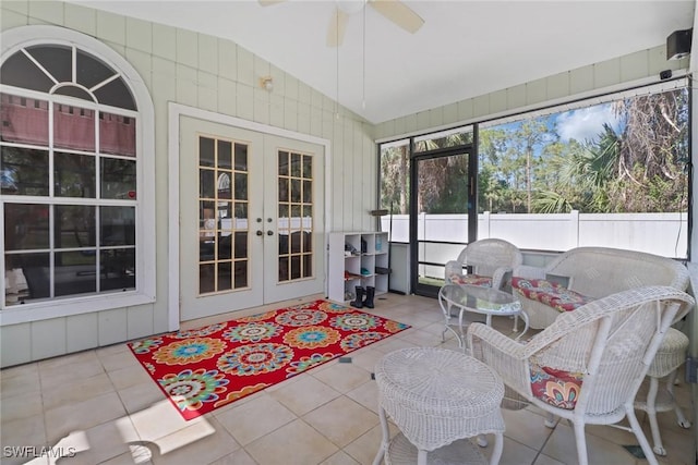 sunroom featuring vaulted ceiling, ceiling fan, and french doors