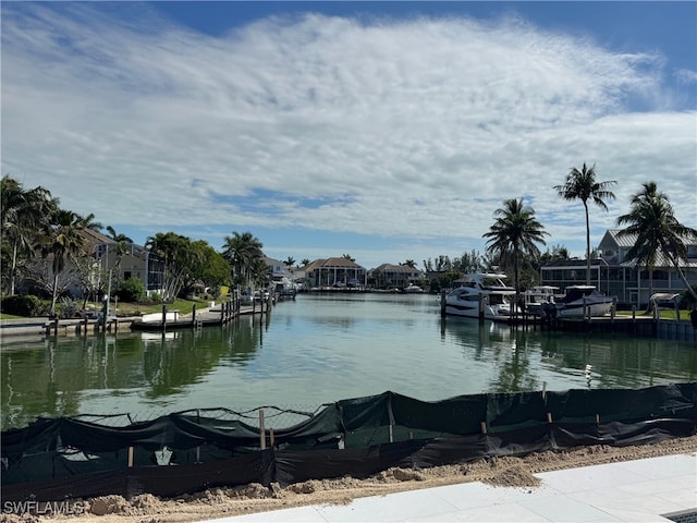 view of water feature with a residential view and a boat dock