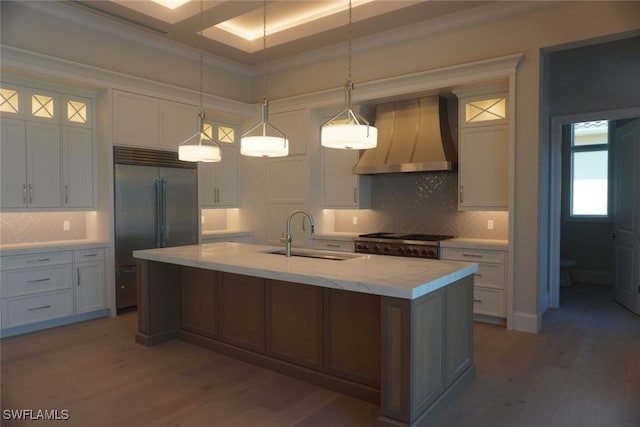 713 Nautilus Ct, Marco Island, FL 34145 - kitchen featuring built in refrigerator, a sink, custom range hood, tasteful backsplash, and light wood-style floors