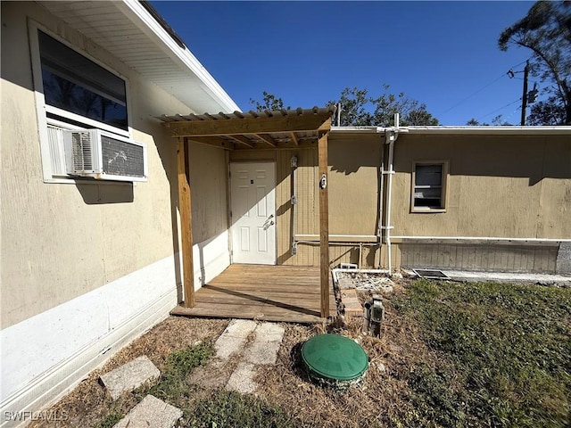 doorway to property featuring cooling unit