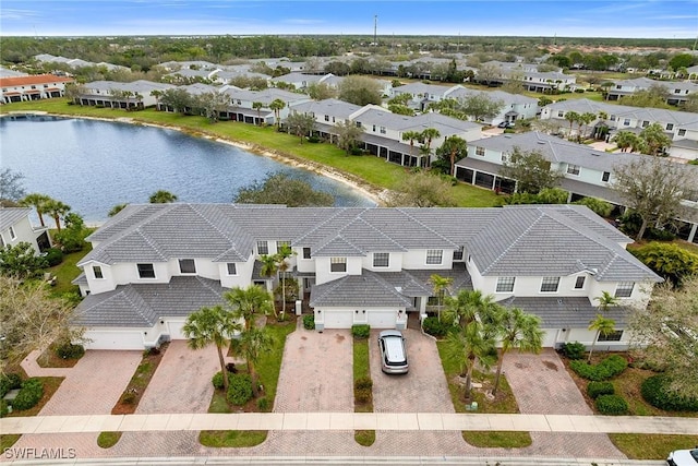 bird's eye view with a residential view and a water view