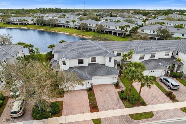 bird's eye view featuring a residential view and a water view