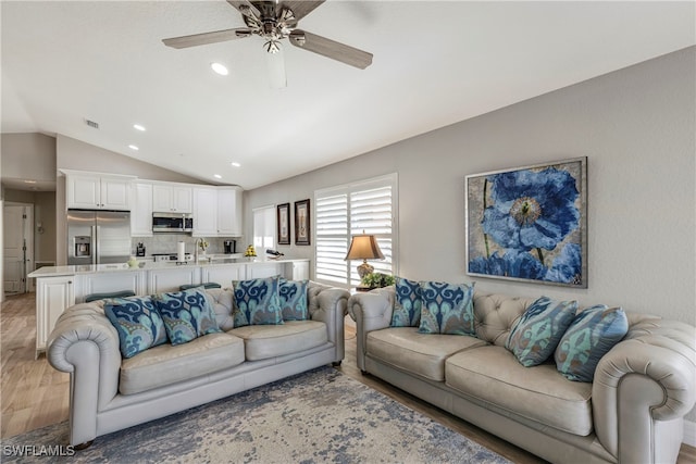 living room featuring recessed lighting, visible vents, light wood-style floors, vaulted ceiling, and ceiling fan