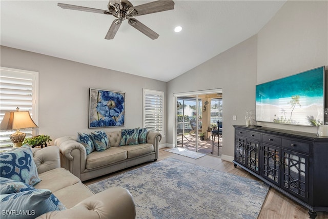 living area featuring ceiling fan, high vaulted ceiling, recessed lighting, wood finished floors, and baseboards