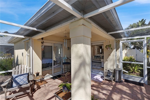 view of patio / terrace with glass enclosure