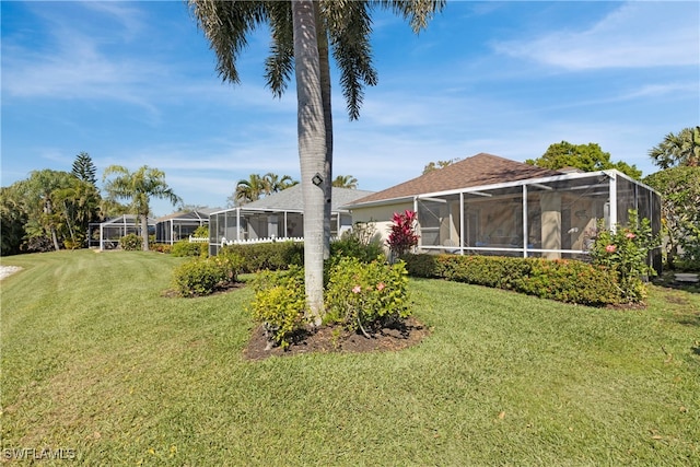 view of yard with a lanai