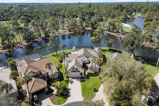 birds eye view of property with a water view