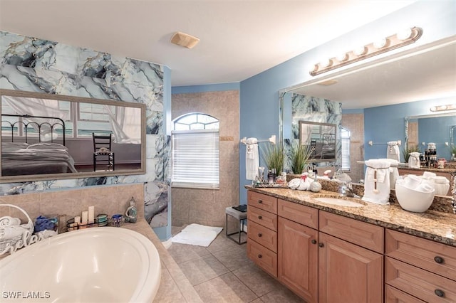 bathroom with tile walls, vanity, a walk in shower, tile patterned flooring, and a bath