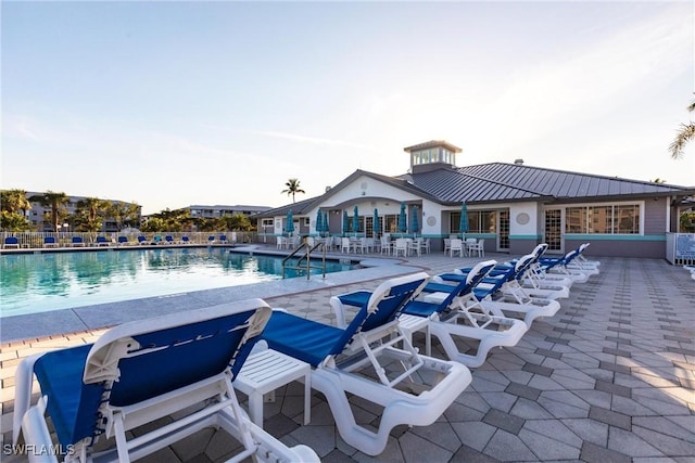 community pool with a patio area