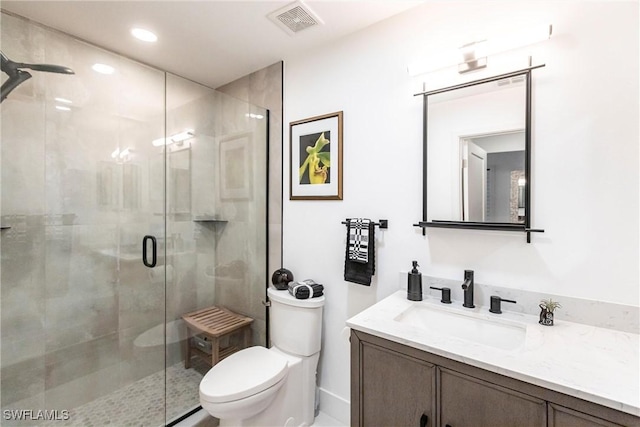 bathroom with a stall shower, visible vents, toilet, vanity, and recessed lighting