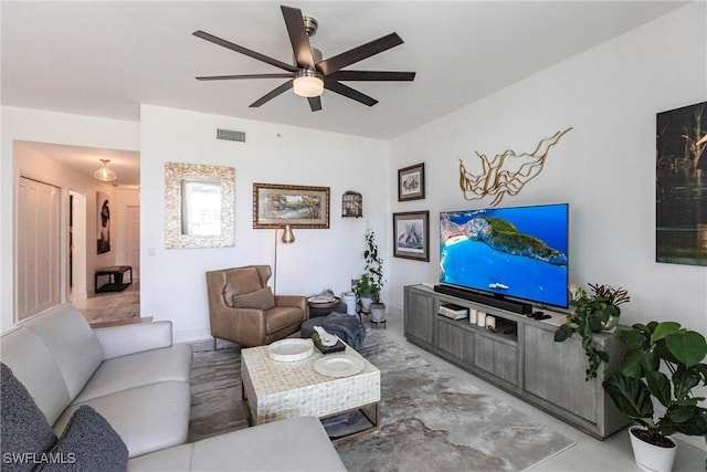 living room featuring visible vents and ceiling fan