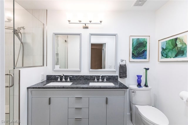 bathroom featuring a sink, visible vents, and a shower stall