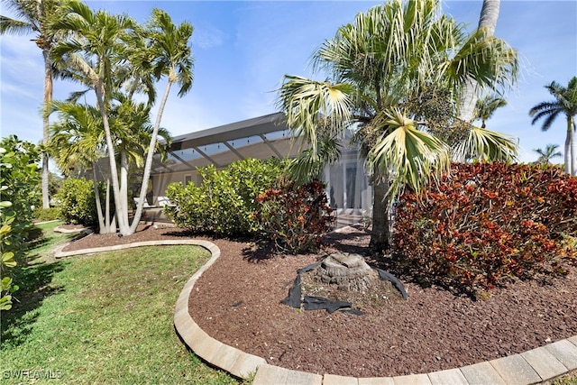 view of yard with a lanai