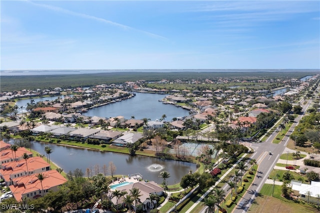 bird's eye view with a water view and a residential view