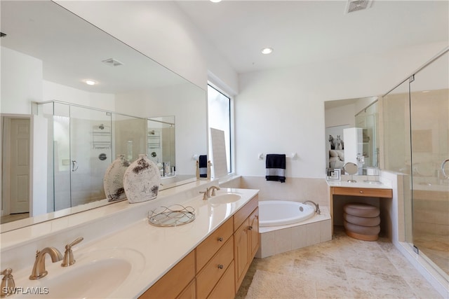 bathroom with a stall shower, visible vents, and a sink