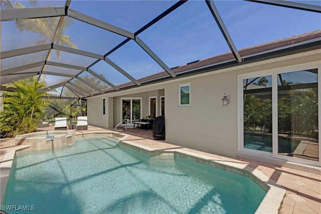 view of pool featuring a patio area and a pool with connected hot tub