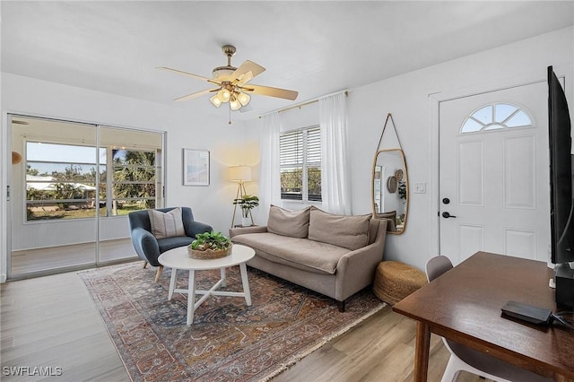 7431 Barrancas Ave, Bokeelia, FL 33922 - living room with ceiling fan and wood finished floors