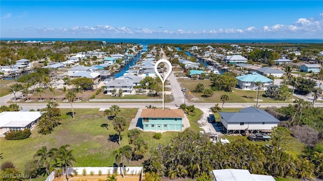 birds eye view of property with a residential view