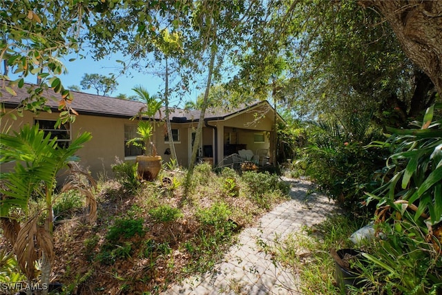 exterior space featuring stucco siding