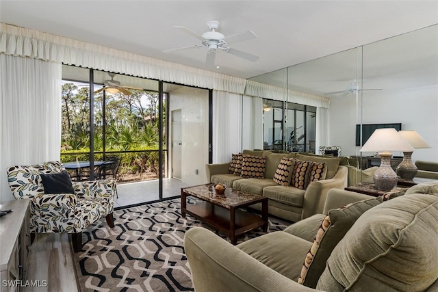 living room featuring wood finished floors and a ceiling fan