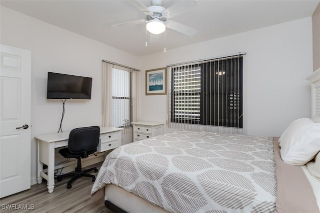 bedroom featuring a ceiling fan and light wood-style floors