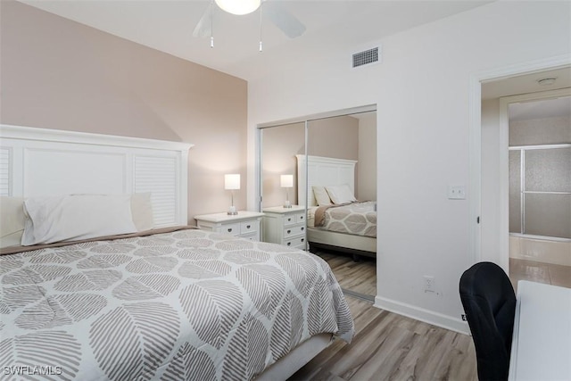 bedroom featuring a ceiling fan, baseboards, visible vents, light wood-style floors, and a closet