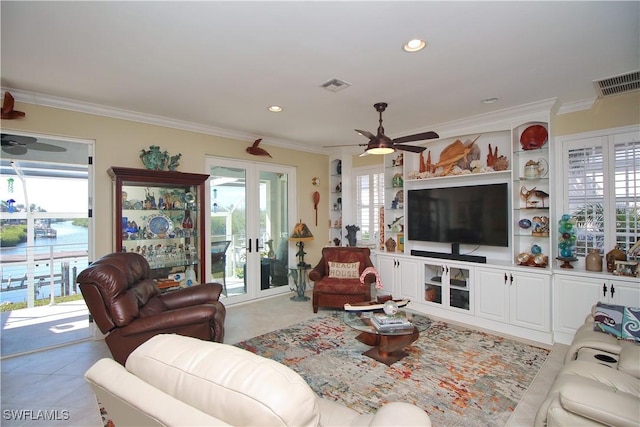 living area with visible vents and crown molding