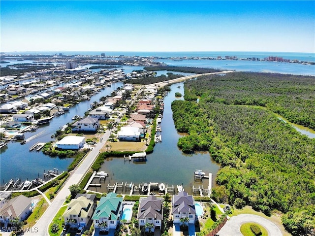 bird's eye view featuring a water view and a residential view