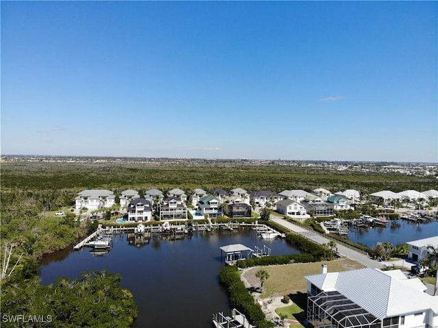 birds eye view of property featuring a residential view and a water view