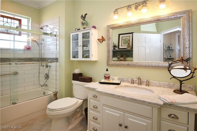 bathroom with toilet, shower / bath combination with glass door, crown molding, and vanity