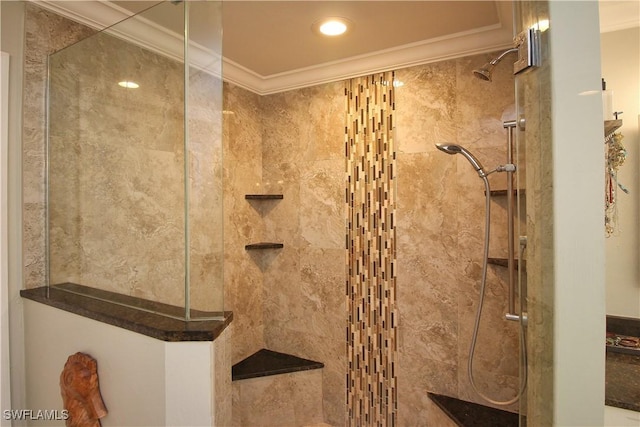 bathroom with a walk in shower and crown molding